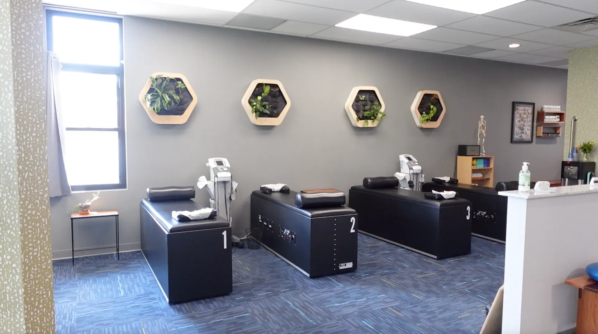 Intersegmental traction roller tables in the relaxing therapy bay at Gateway Chiropractic in St. Louis, MO.