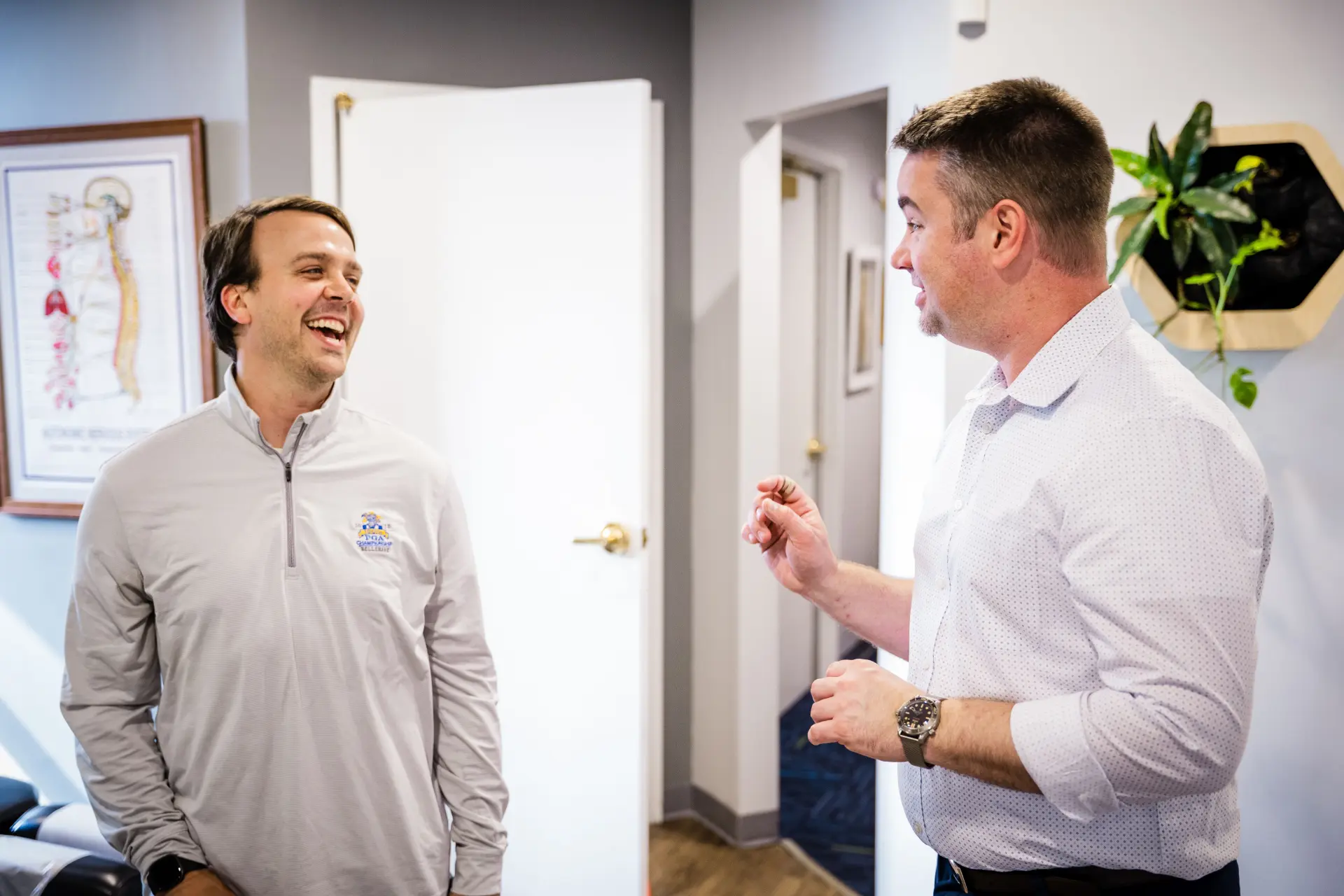 Dr. Joe Sas having a real conversation with a patient at Gateway Chiropractic in St. Louis, MO.